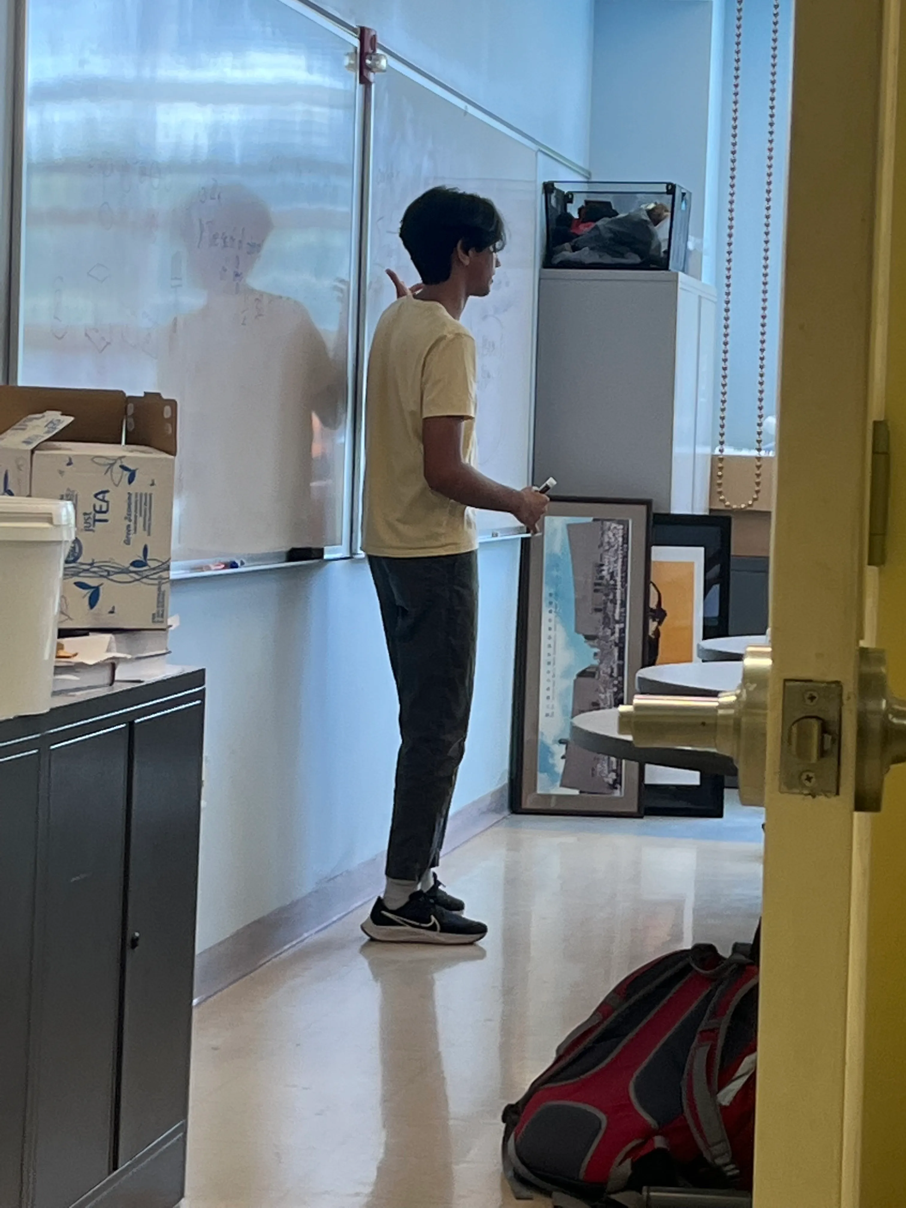 Krish teaching group theory at the whiteboard